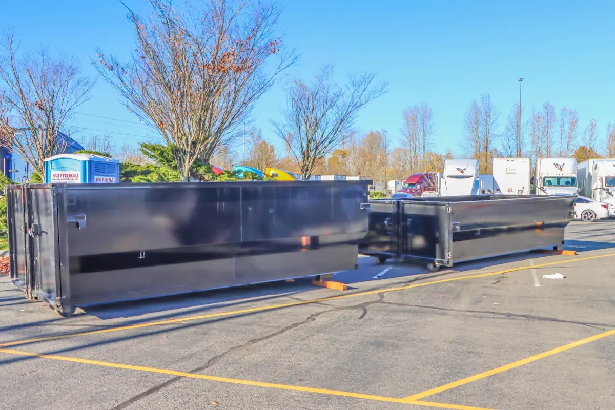 Professional dumpster rental service with roll-off container on residential driveway in Citrus Heights